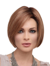 headshot of model wearing red chin length wig