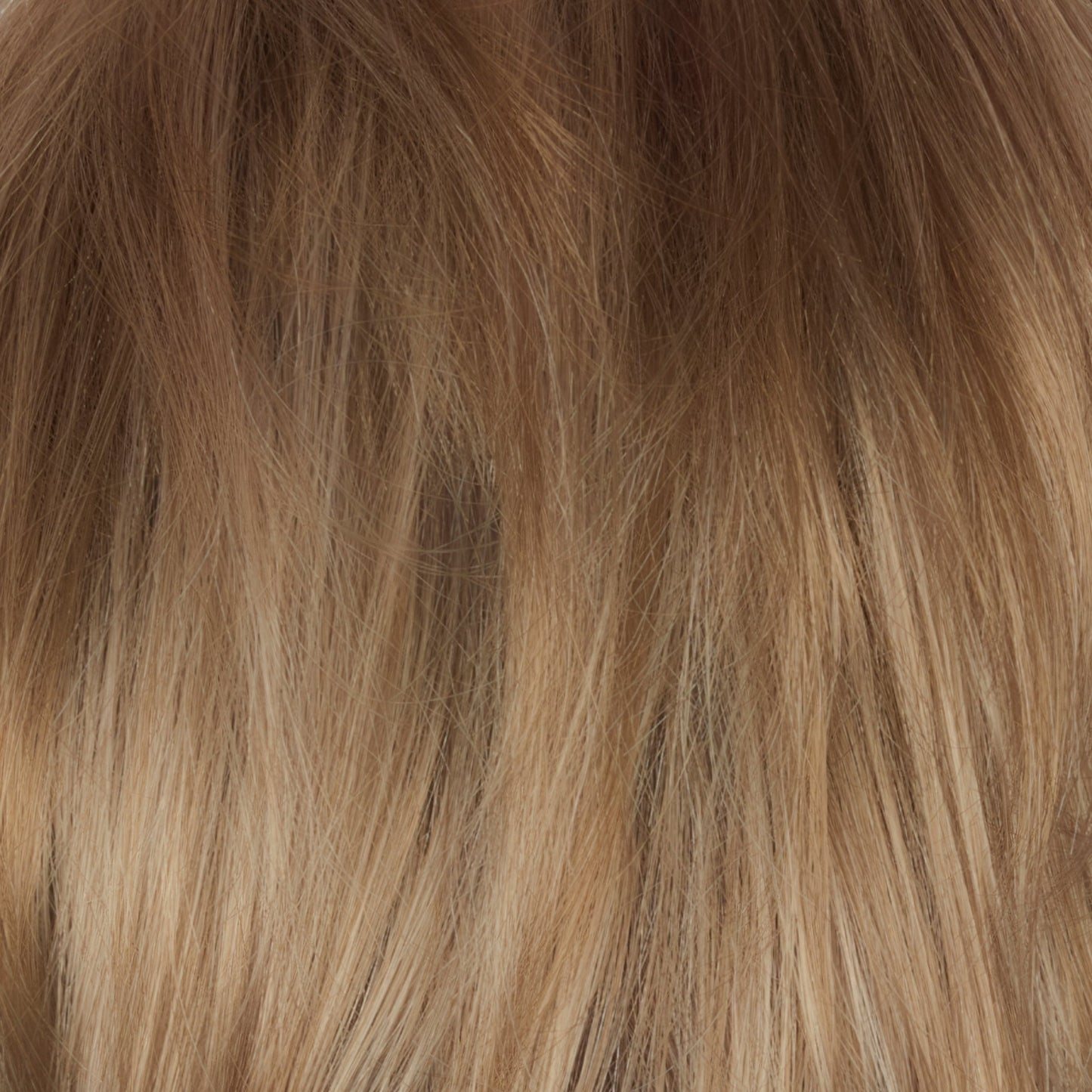 Champagne Sunset - A luxurious dark/medium multi-tonal blond with a chocolate brown root regrowth Â that captures the essence of a summer sunset. This beautiful color is ideal for those who appreciate textured honey, ash and gold hues.